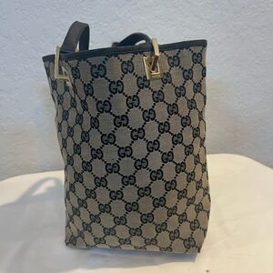 Reposhing: Gucci Beige and Black mini Tote Bag.